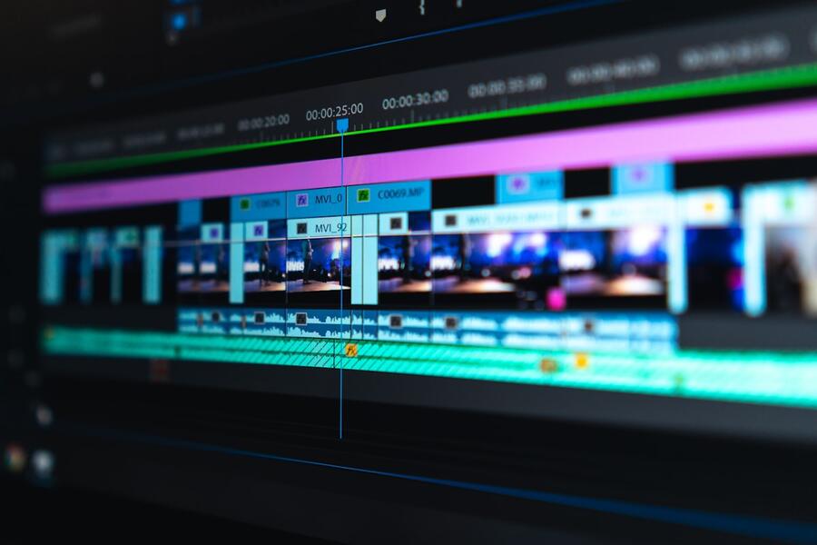A video editing timeline with colour-coded clips